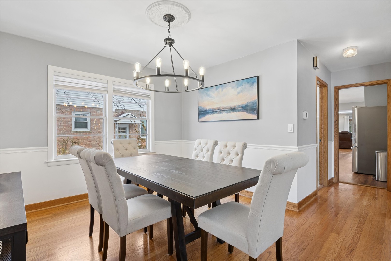 309 Clinton Avenue Elmhurst, IL 60126 - Photo 10 of 33 a view of a dining room with furniture wooden floor and chandelier