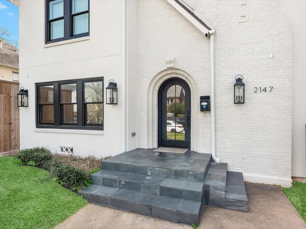 a large kitchen with stainless steel appliances granite countertop a lot of counter space and wooden floors
