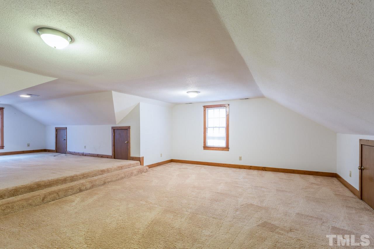 10405 Boxelder Drive Raleigh, NC 27613 - Photo 13 of 25 Bonus Room has permanent stairs