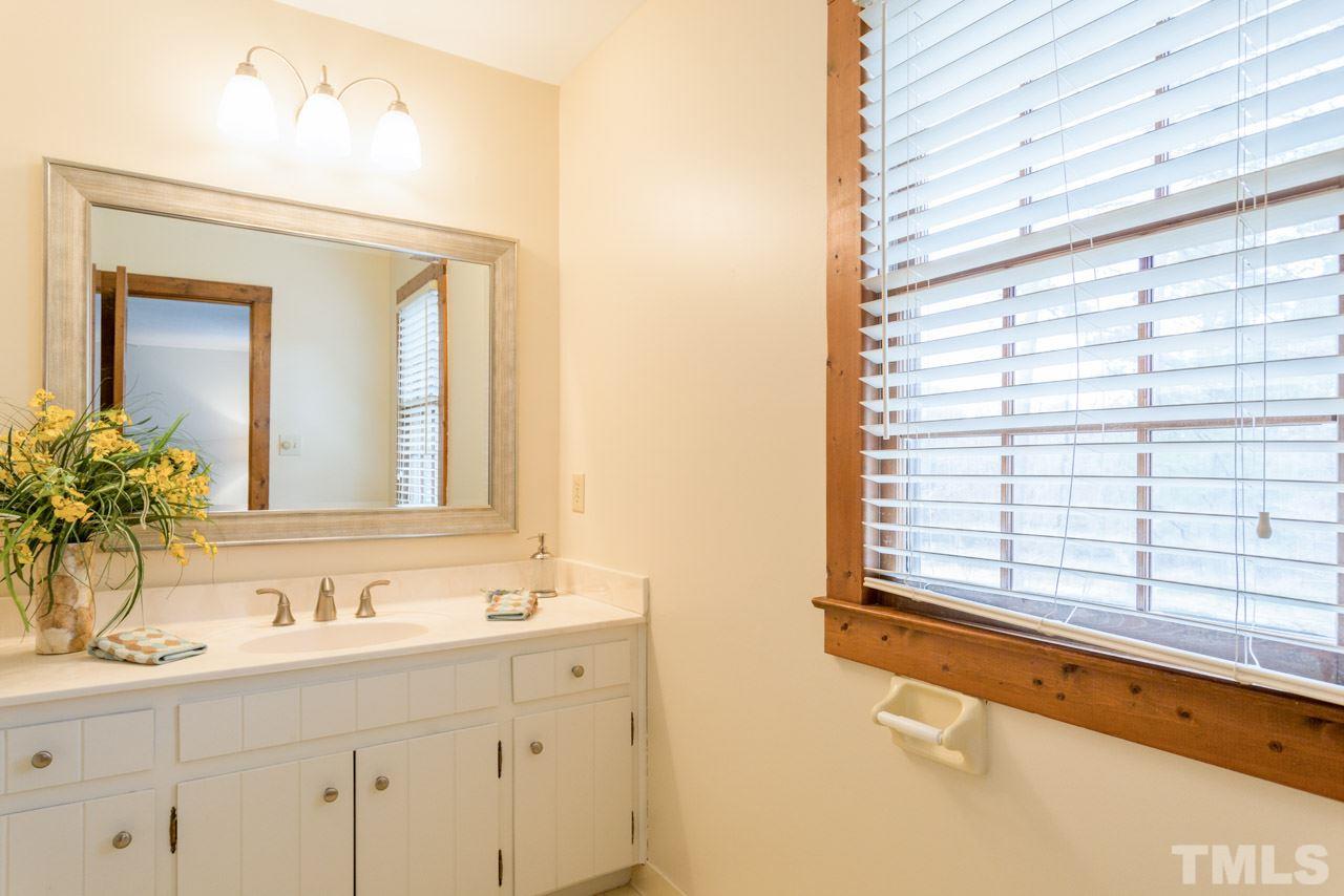 10405 Boxelder Drive Raleigh, NC 27613 - Photo 19 of 25 Freshly painted, with new mirror and light fixture. Tiled Shower.