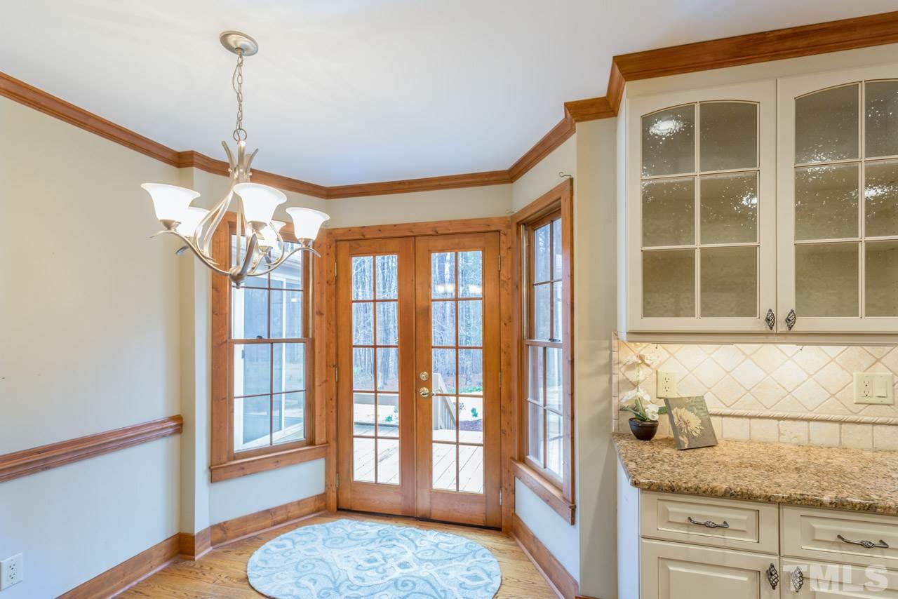 10405 Boxelder Drive Raleigh, NC 27613 - Photo 5 of 25 This view also shows two glass door cabinets