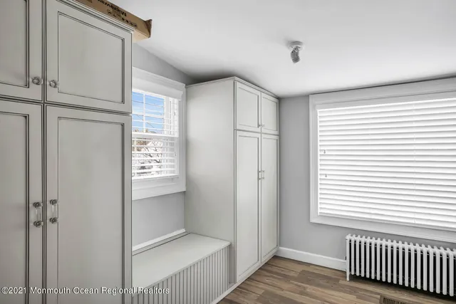 a bedroom with a bed and with a window