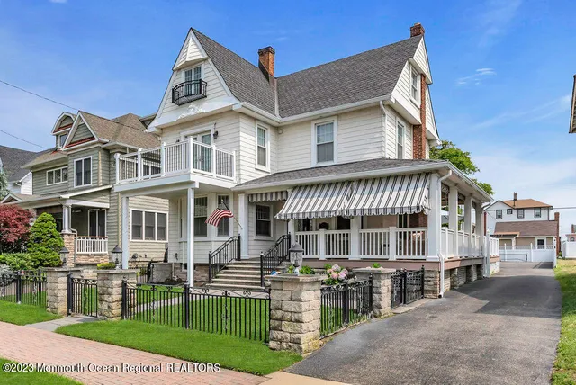 a balcony with furniture and a potted plant