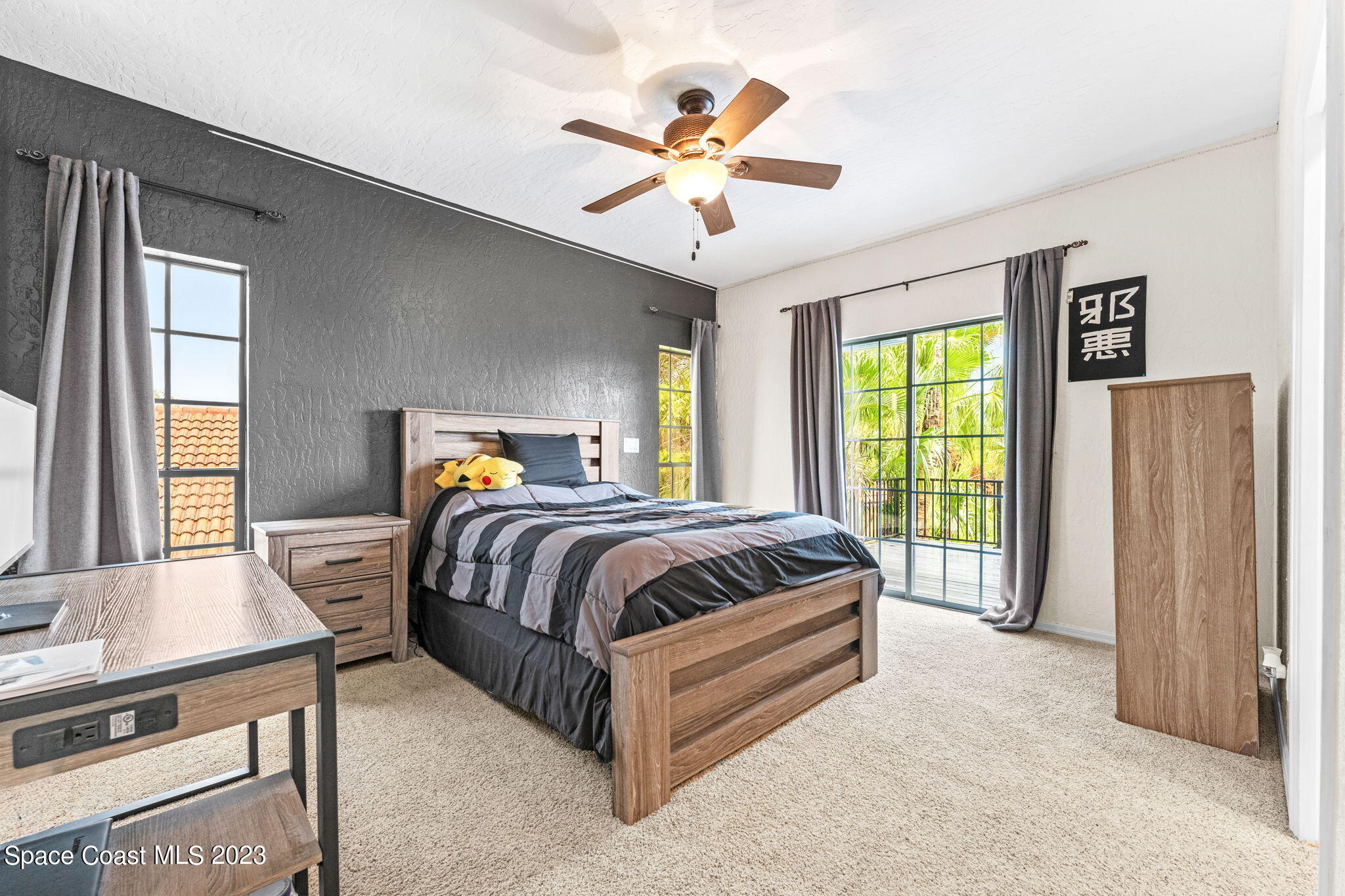 70 Lanternback Island Drive Satellite Beach, FL 32937 - Photo 13 of 26 a spacious bedroom with a bed and window