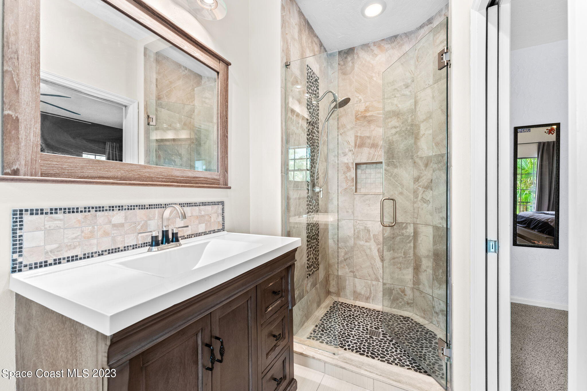 70 Lanternback Island Drive Satellite Beach, FL 32937 - Photo 14 of 26 a bathroom with a sink and a mirror