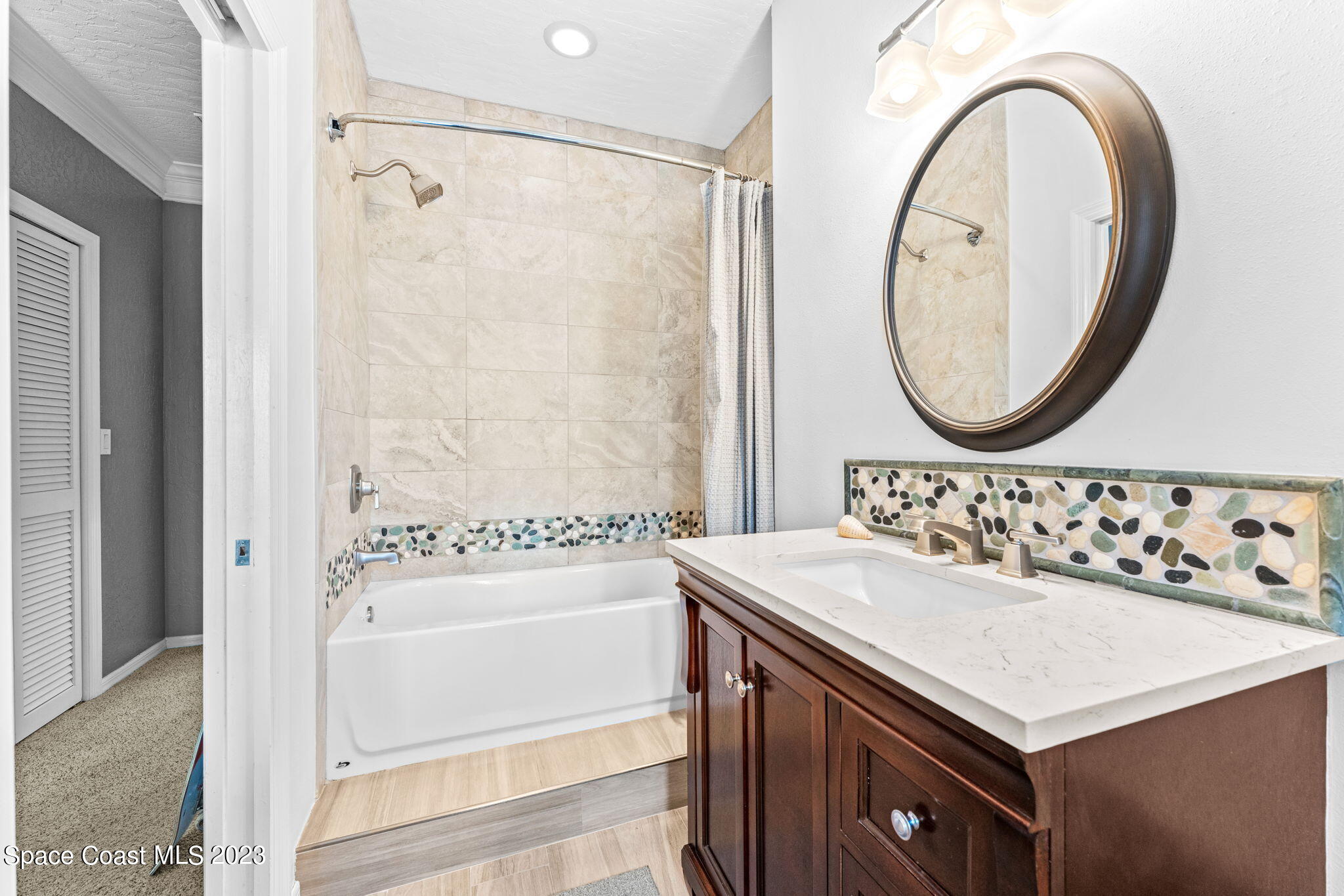 70 Lanternback Island Drive Satellite Beach, FL 32937 - Photo 16 of 26 a bathroom with a sink and a mirror