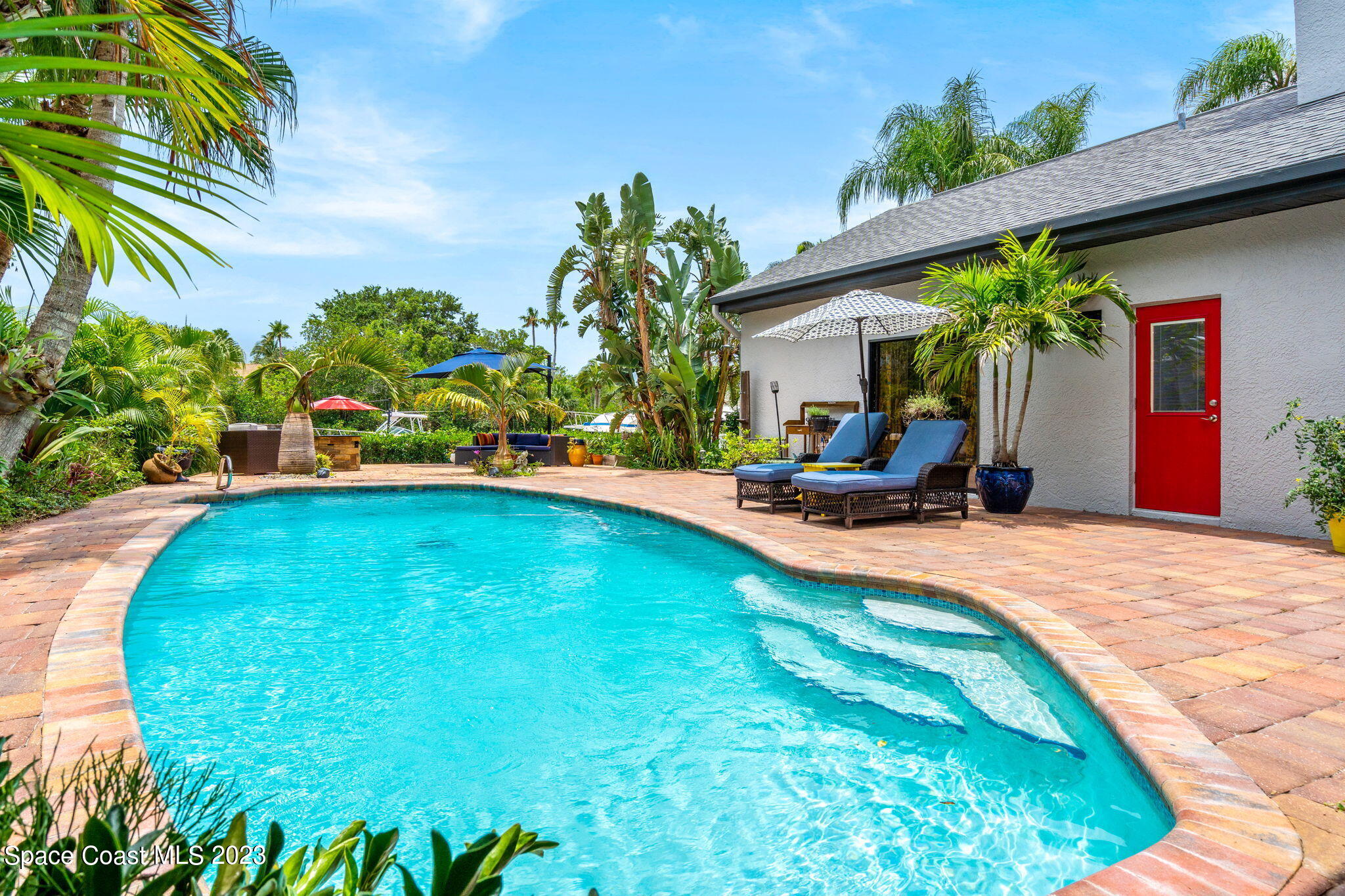 70 Lanternback Island Drive Satellite Beach, FL 32937 - Photo 18 of 26 a view of a backyard with a patio
