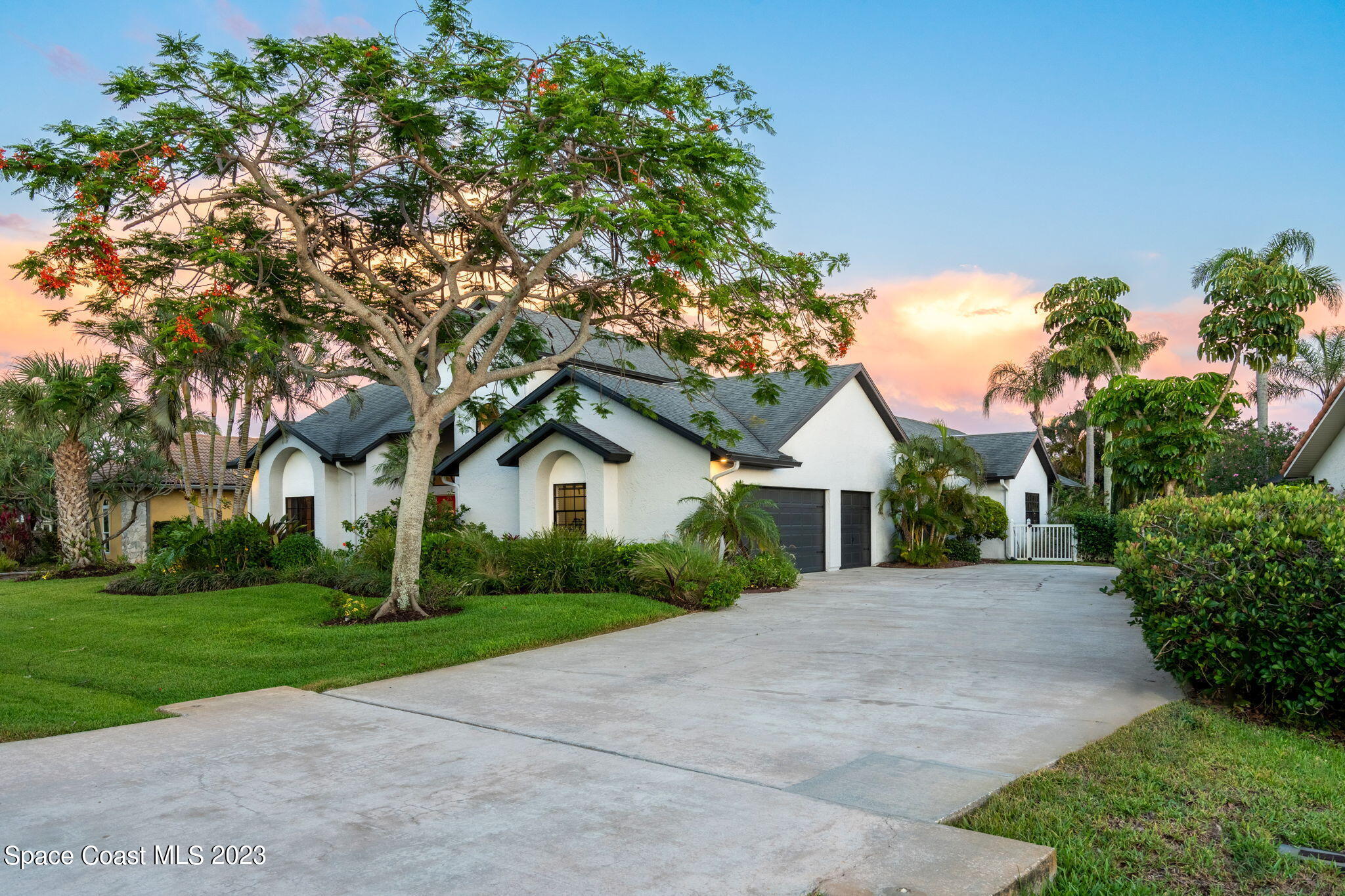 70 Lanternback Island Drive Satellite Beach, FL 32937 - Photo 25 of 26 a front view of a house with yard and green space