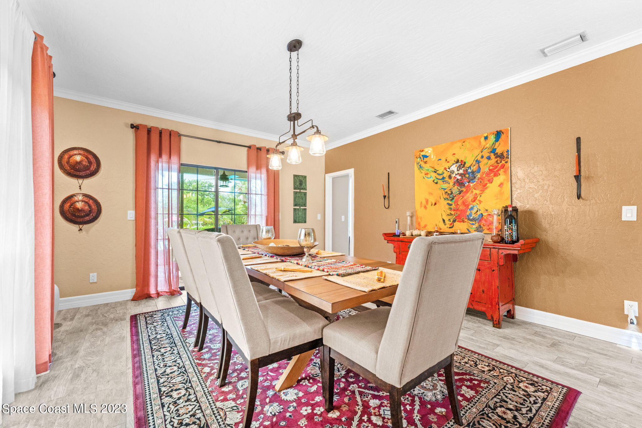 70 Lanternback Island Drive Satellite Beach, FL 32937 - Photo 4 of 26 a view of a dining room with furniture window and wooden floor