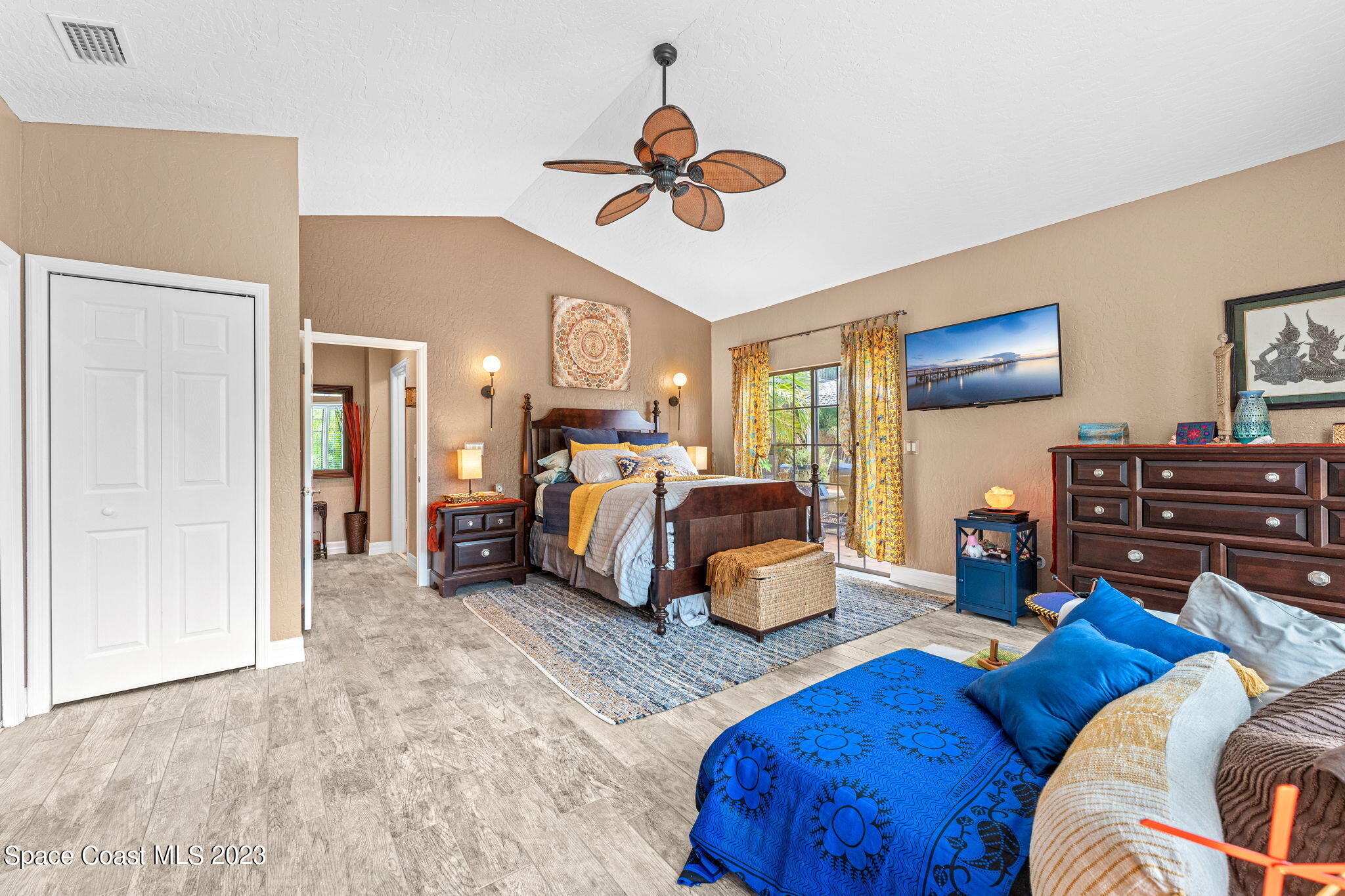 70 Lanternback Island Drive Satellite Beach, FL 32937 - Photo 8 of 26 a bedroom with furniture and a large window