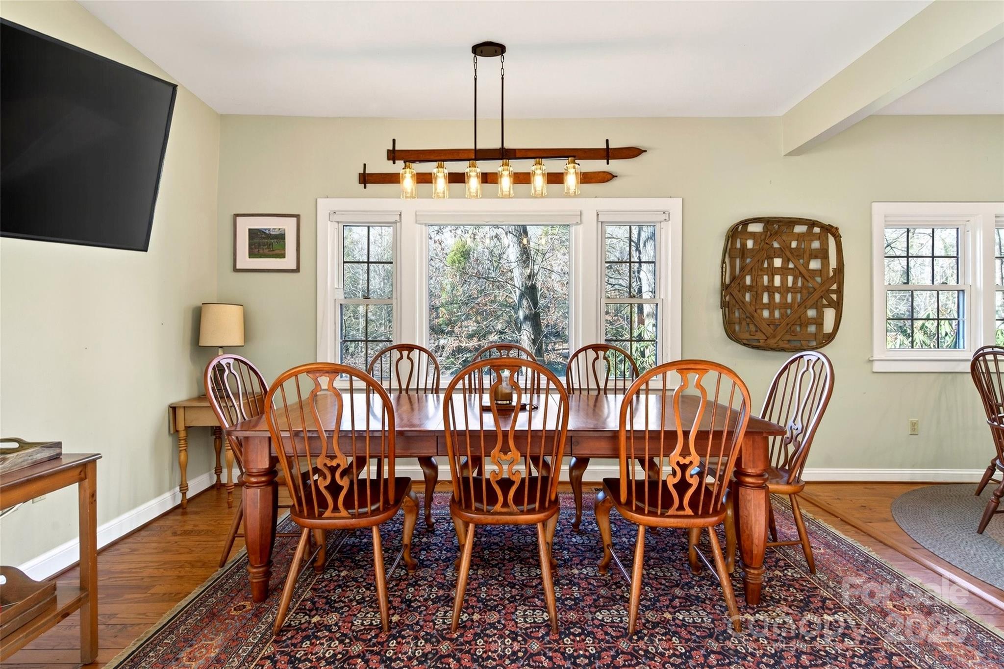 308 Texas Road Montreat, NC 28711 - Photo 12 of 48 a view of a dining room with furniture window and wooden floor