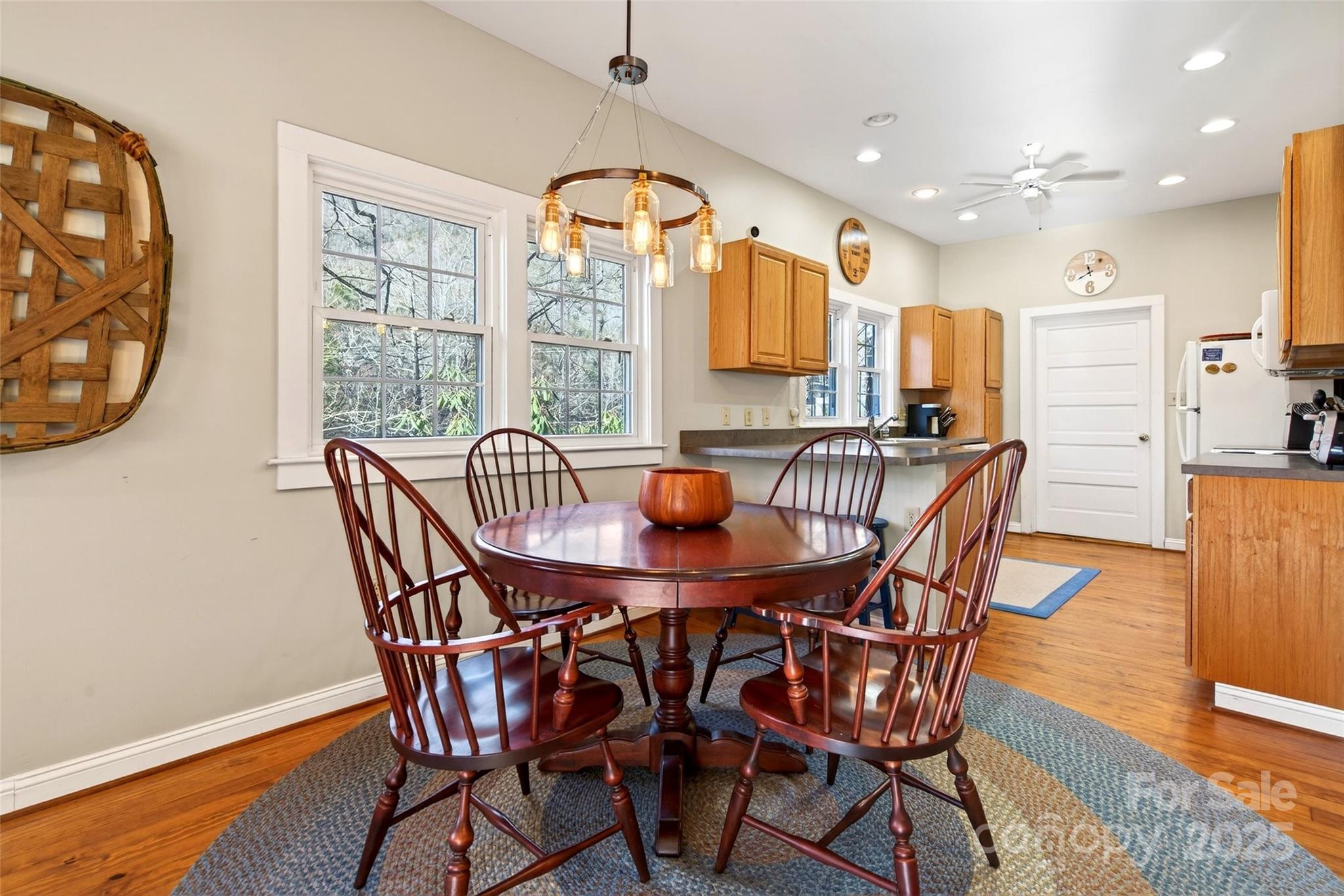 308 Texas Road Montreat, NC 28711 - Photo 14 of 48 a view of a dining room with furniture window and wooden floor