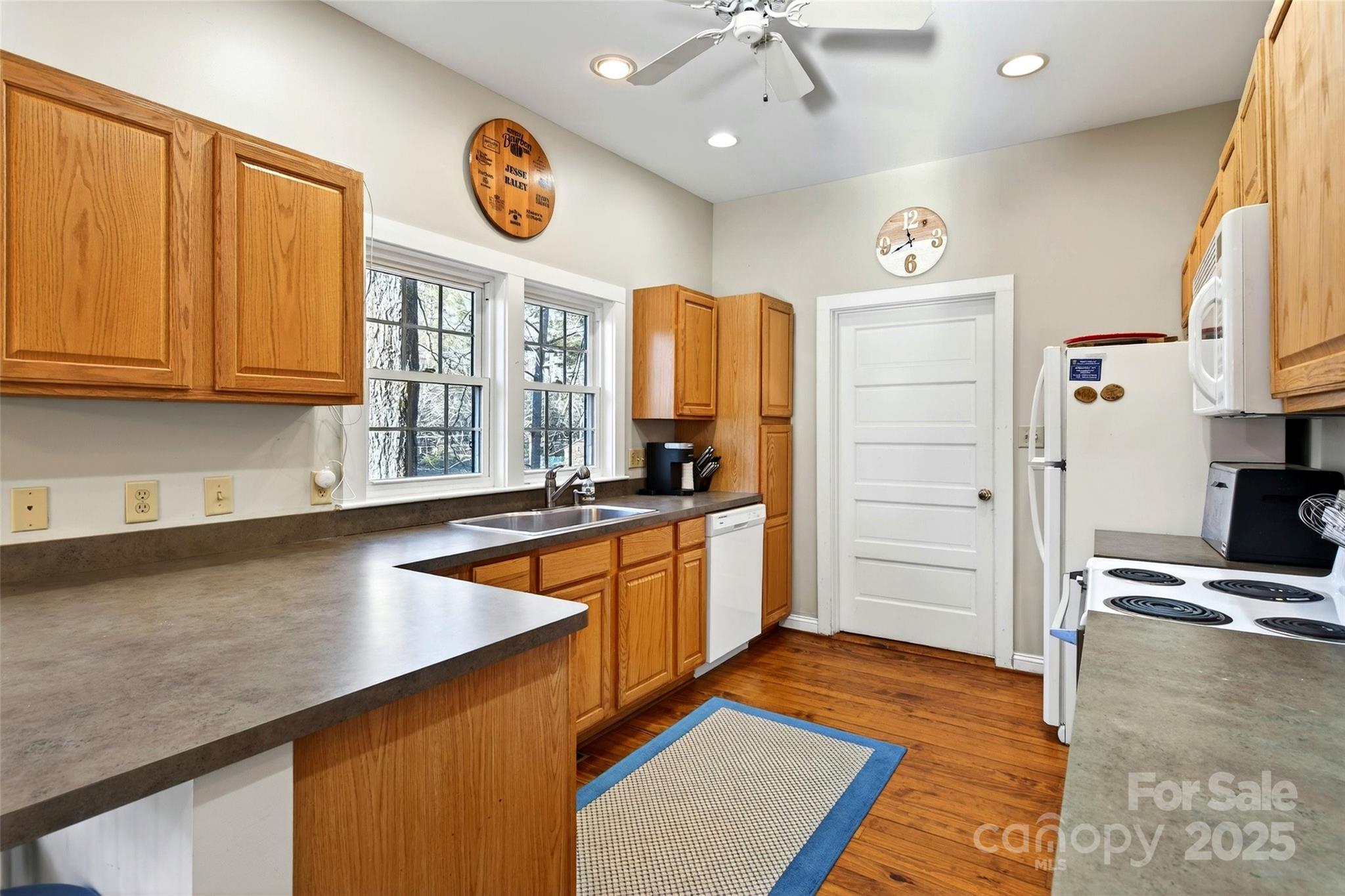 308 Texas Road Montreat, NC 28711 - Photo 17 of 48 a kitchen with stainless steel appliances granite countertop a refrigerator and a stove top oven