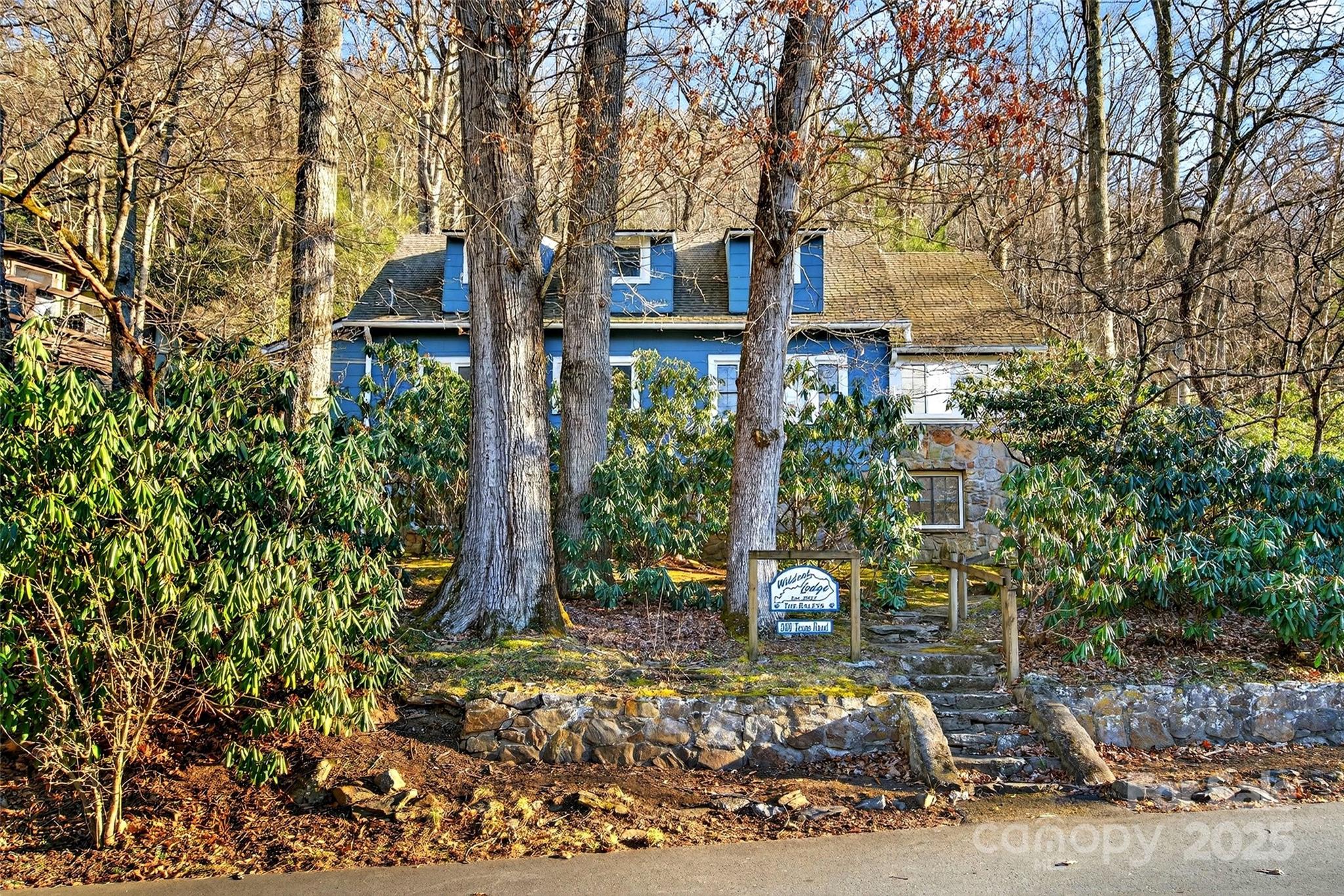 308 Texas Road Montreat, NC 28711 - Photo 2 of 48 a front view of a house with garden