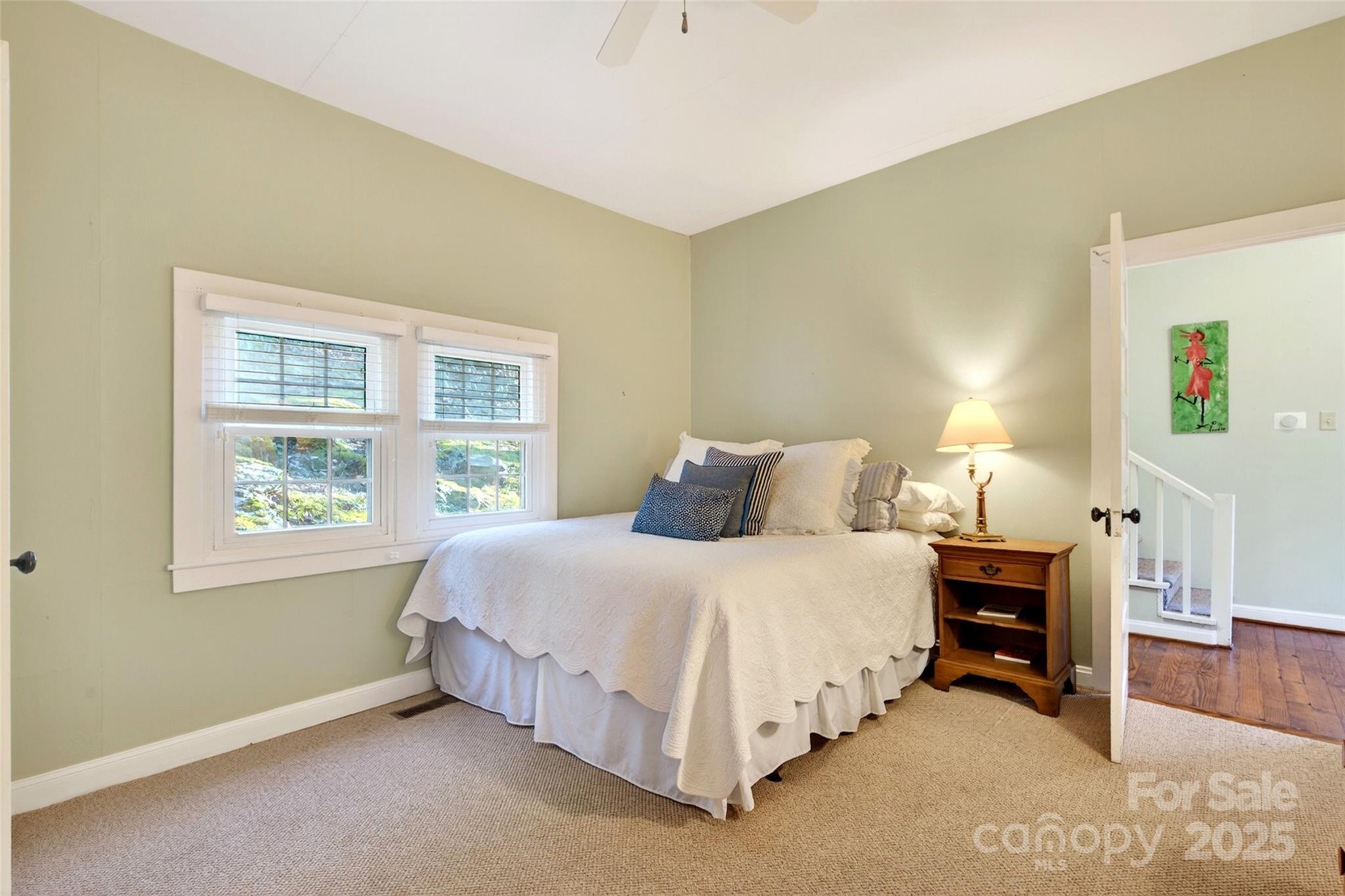 308 Texas Road Montreat, NC 28711 - Photo 21 of 48 a bedroom with a bed and a window