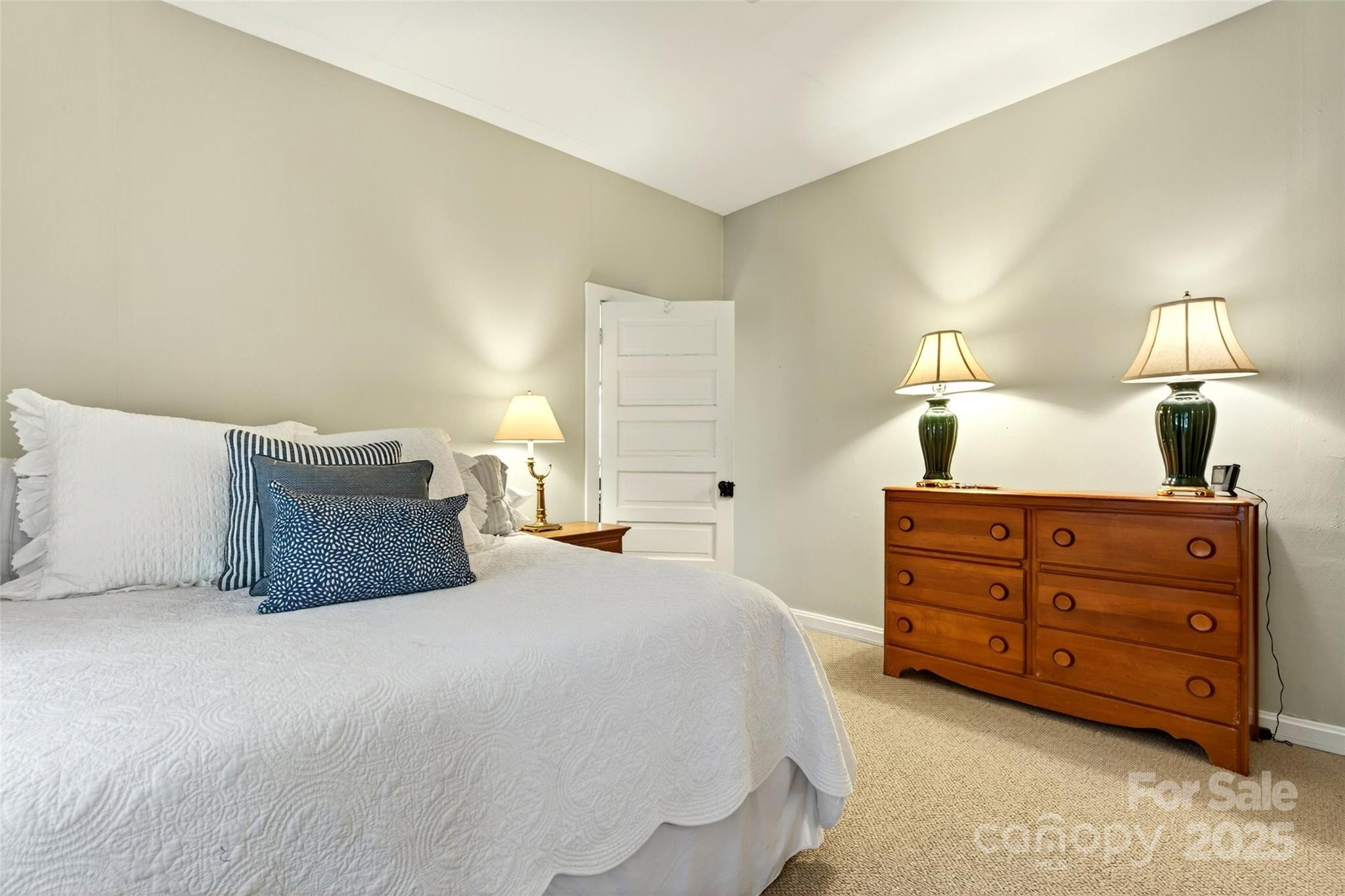 308 Texas Road Montreat, NC 28711 - Photo 22 of 48 a bedroom with a bed and a lamp