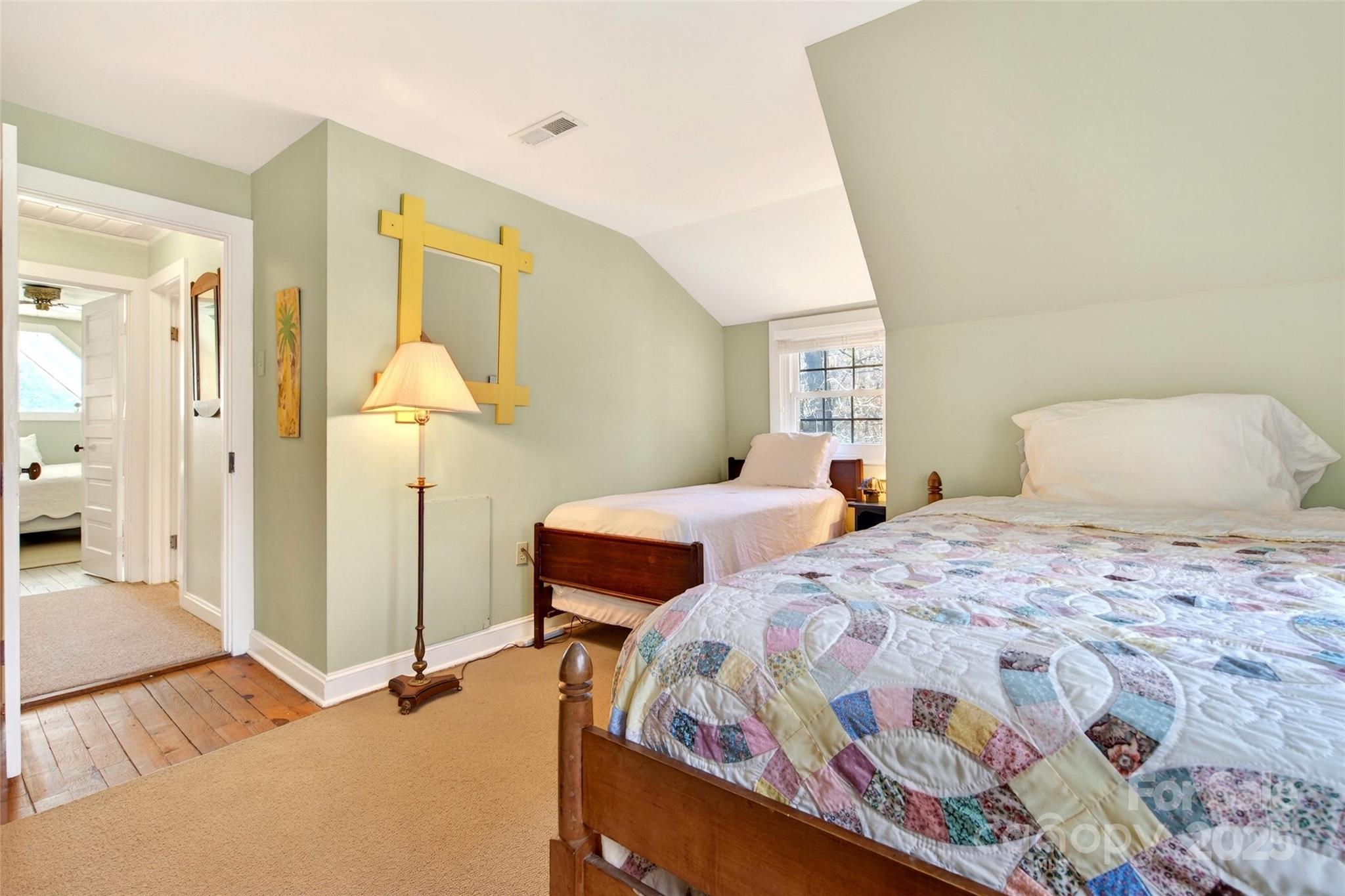 308 Texas Road Montreat, NC 28711 - Photo 26 of 48 a bedroom with a bed and a chandelier