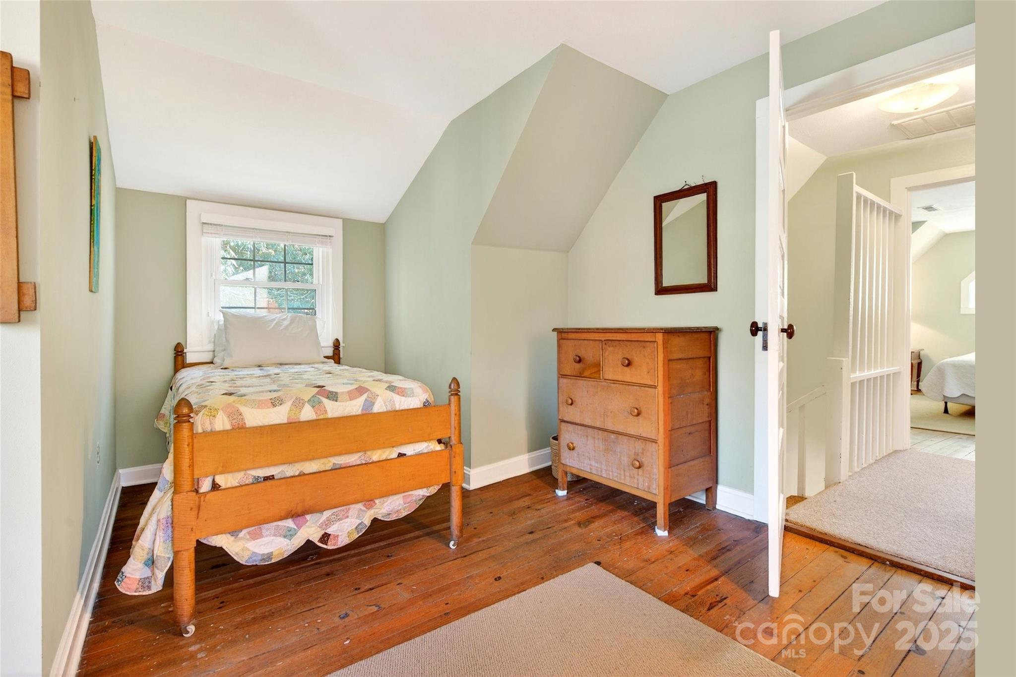 308 Texas Road Montreat, NC 28711 - Photo 27 of 48 a bedroom with a bed and a dresser in it