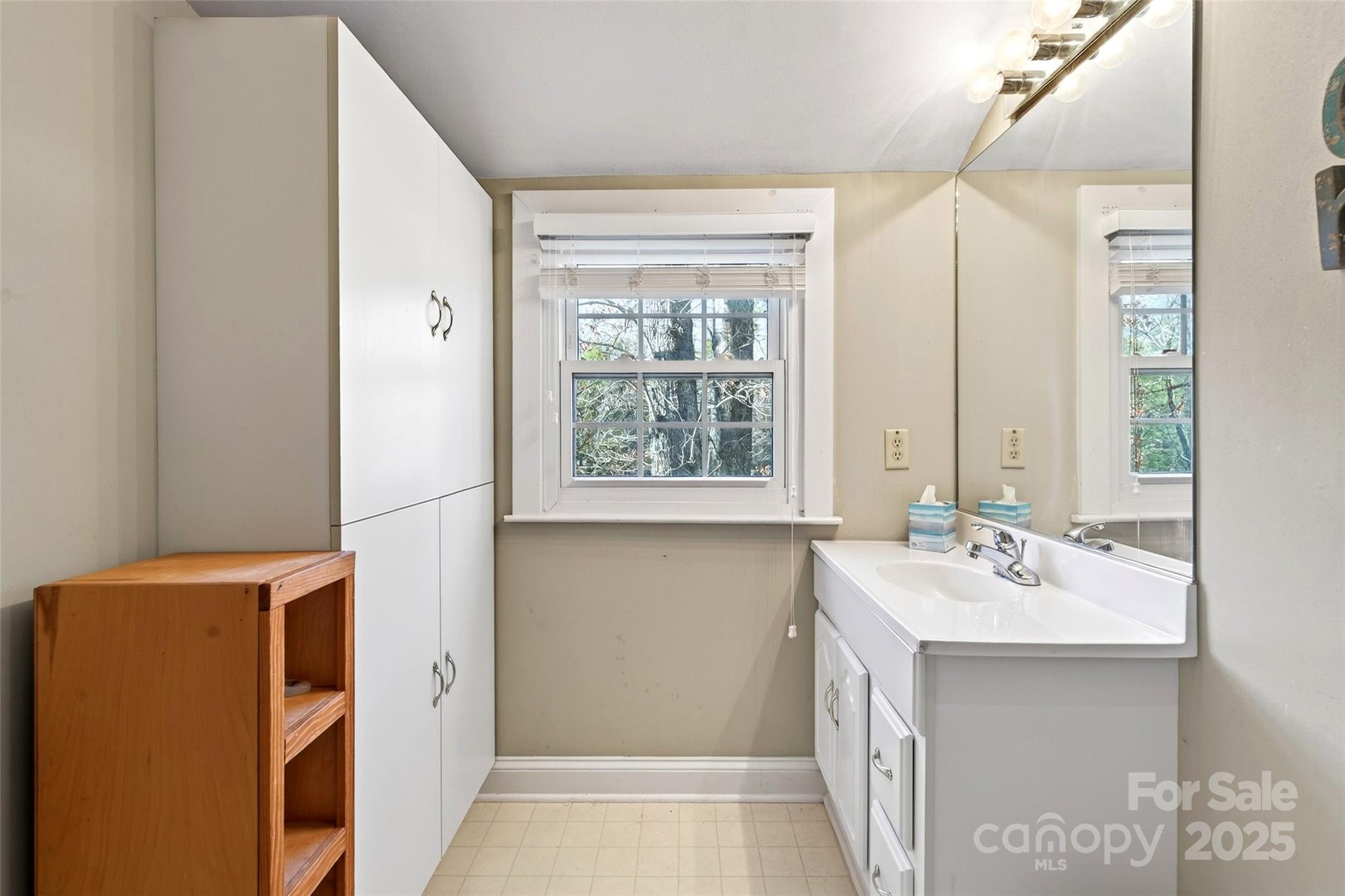 308 Texas Road Montreat, NC 28711 - Photo 28 of 48 a bathroom with a sink and a mirror