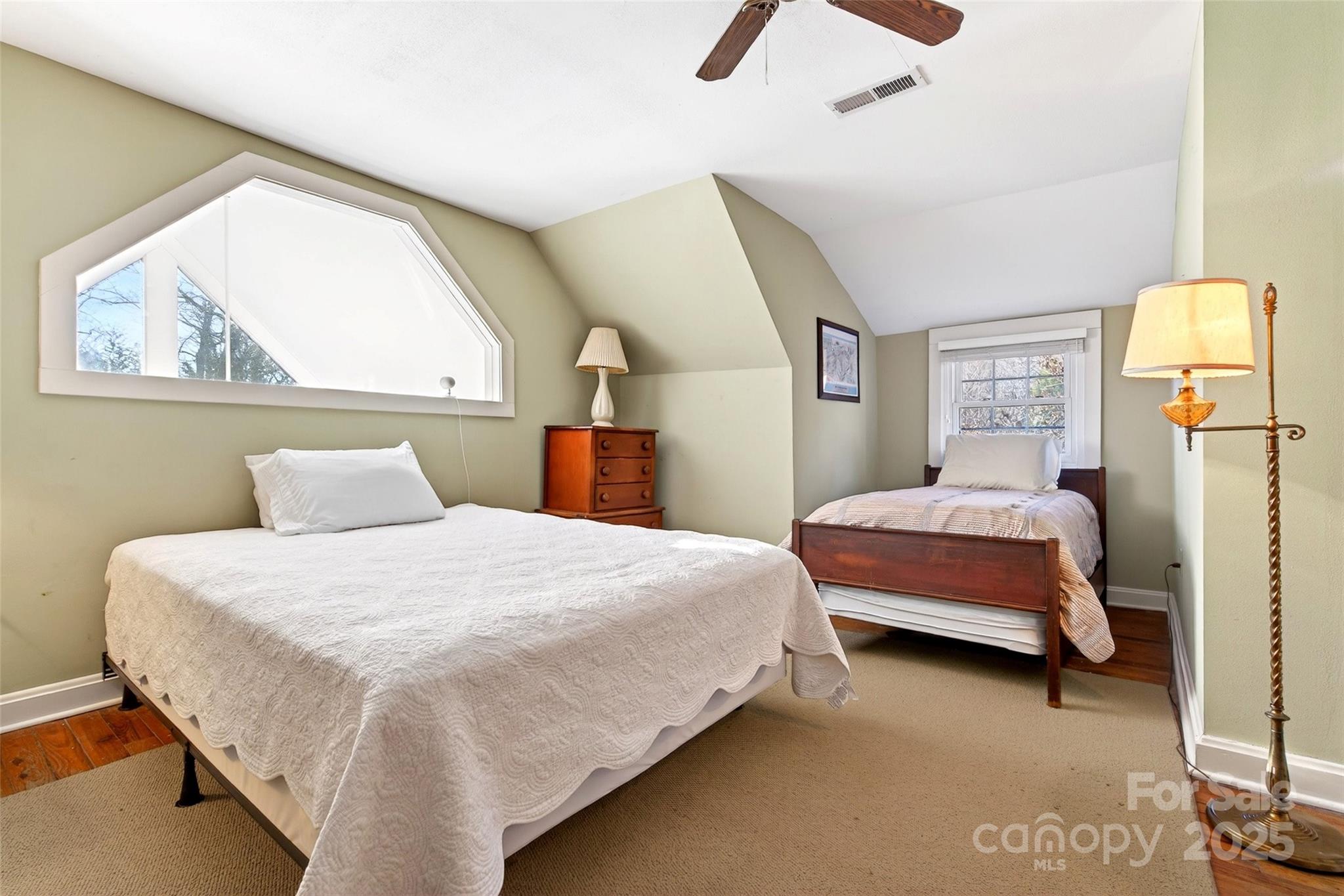 308 Texas Road Montreat, NC 28711 - Photo 33 of 48 a bedroom with a bed a dresser and a window