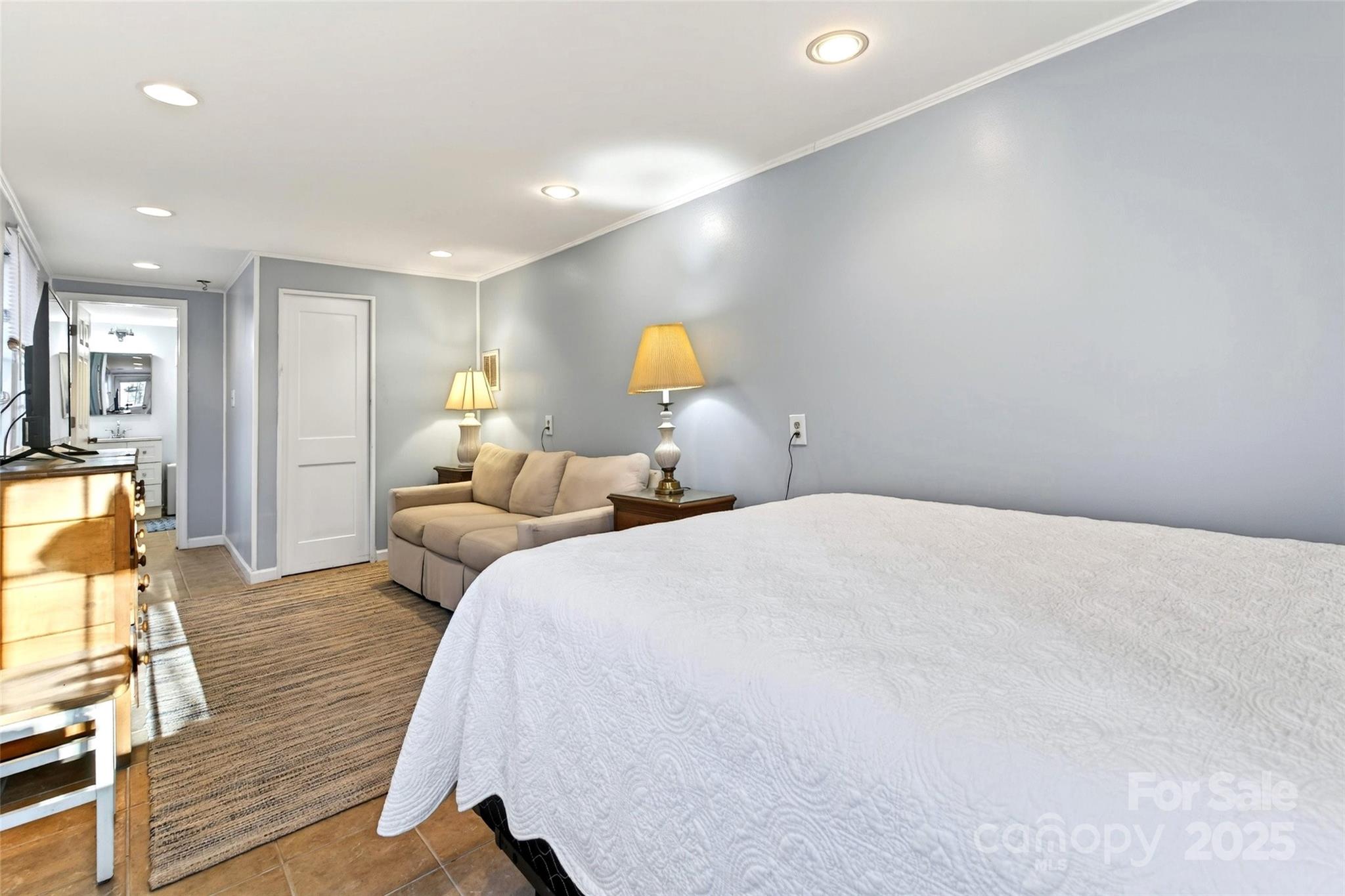 308 Texas Road Montreat, NC 28711 - Photo 35 of 48 a bedroom with a bed and wooden floor