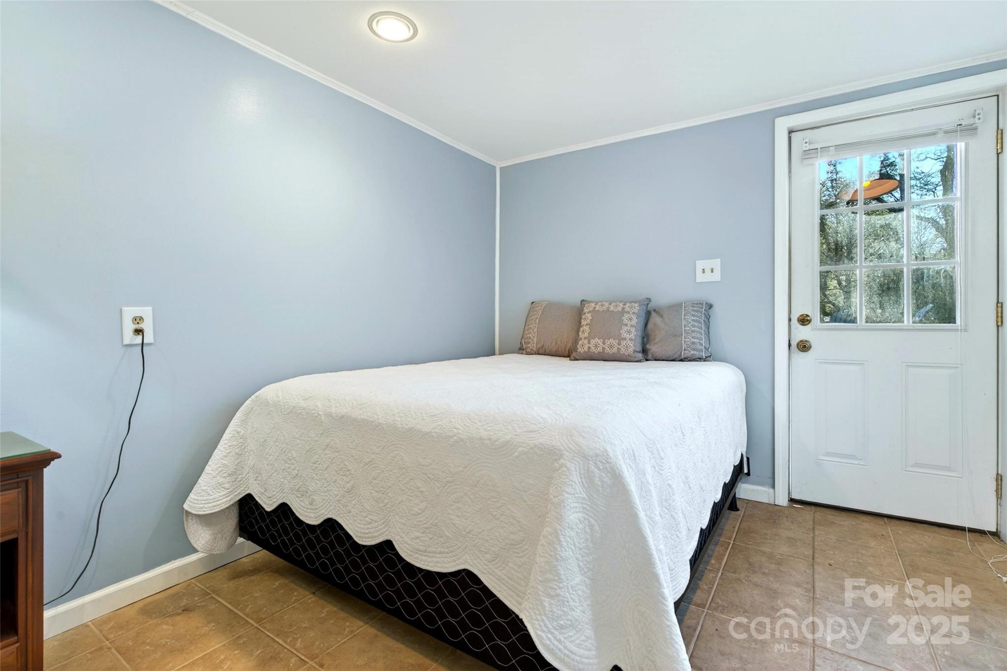 308 Texas Road Montreat, NC 28711 - Photo 36 of 48 a bedroom with a bed and a painting on the wall