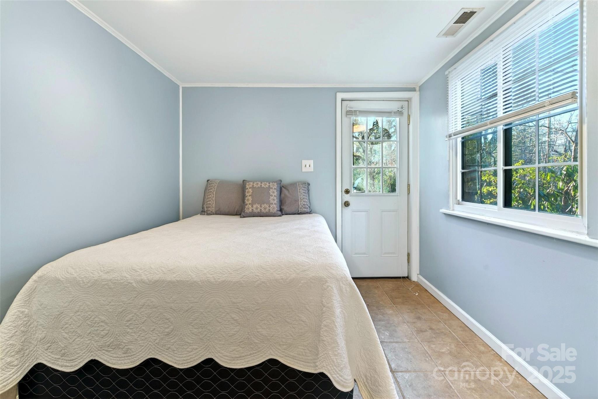 308 Texas Road Montreat, NC 28711 - Photo 37 of 48 a bedroom with a bed and a window