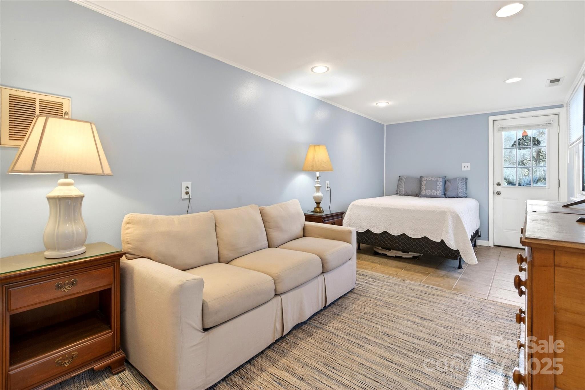 308 Texas Road Montreat, NC 28711 - Photo 40 of 48 a spacious bedroom with a bed and wooden floor