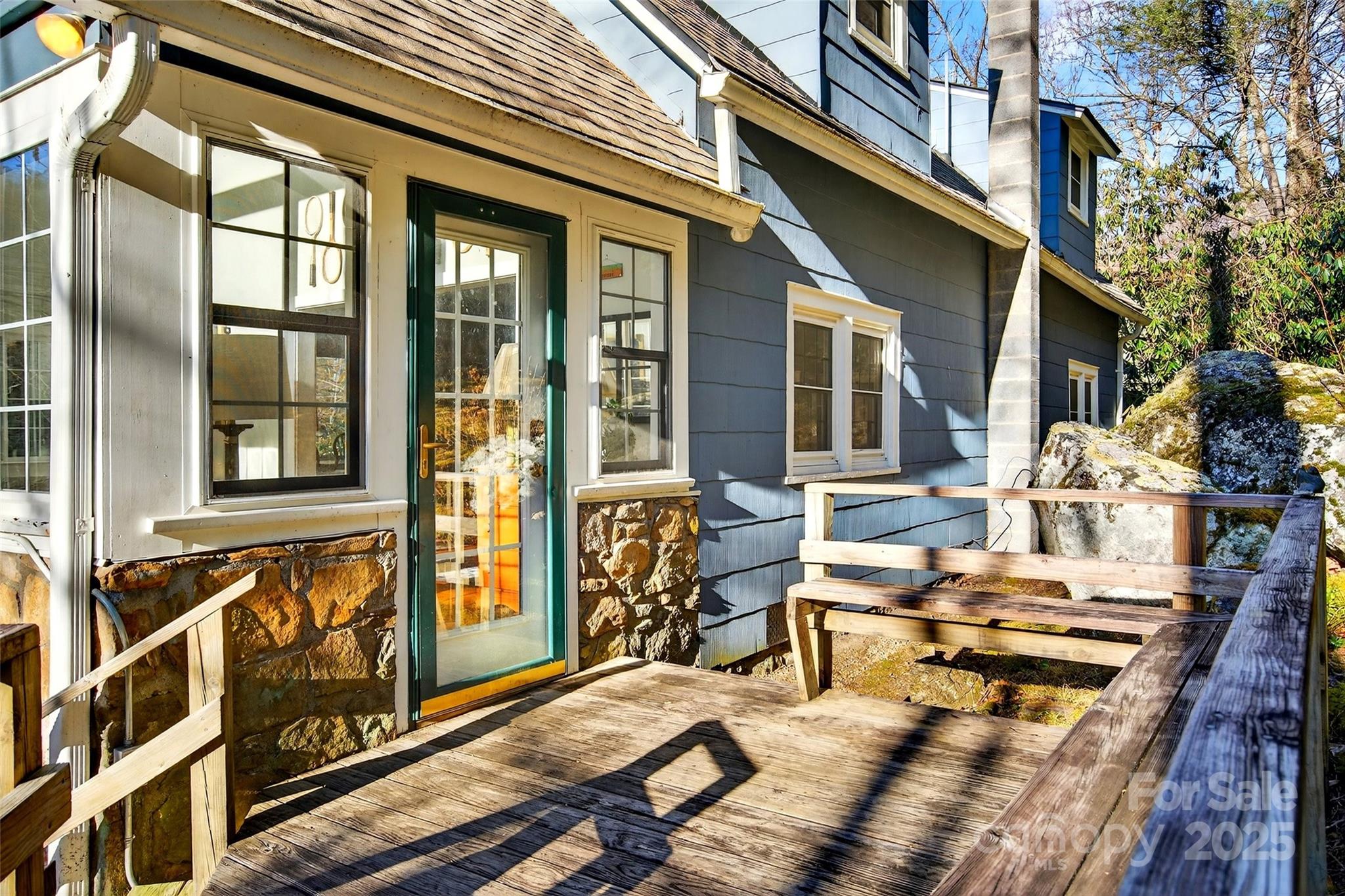 308 Texas Road Montreat, NC 28711 - Photo 5 of 48 a view of a chairs and table in the balcony