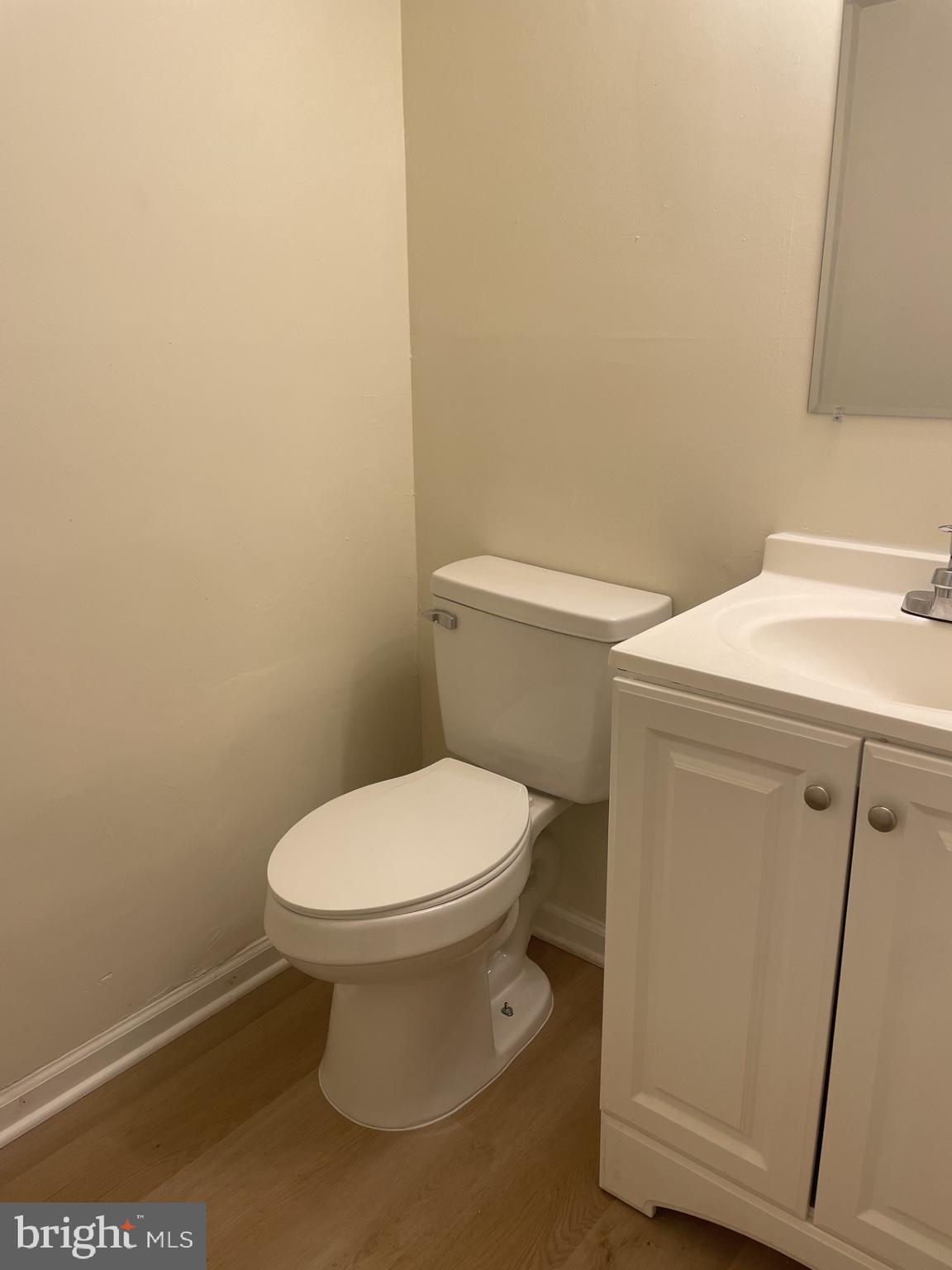 1287 Springtide Place Herndon, VA 20170 - Photo 10 of 23 a white toilet sitting next to a shower
