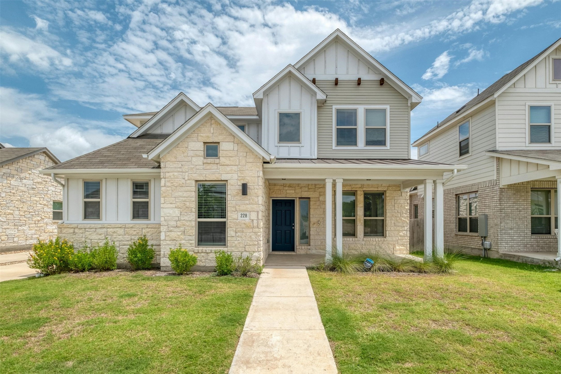 front view of a house with a yard
