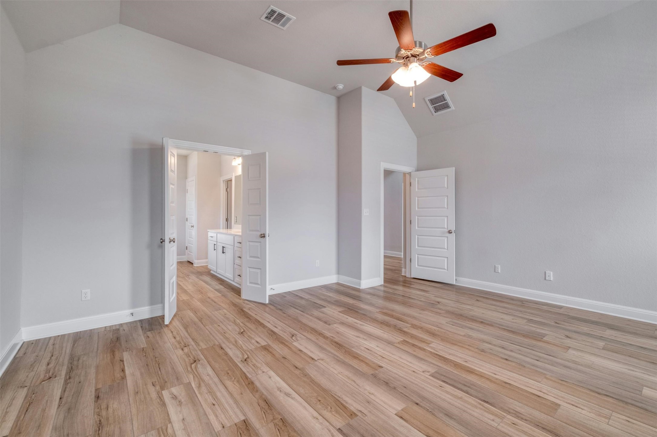 228 Rieber Road Kyle, TX 78640 - Photo 11 of 27 wooden floor in an empty room with a window