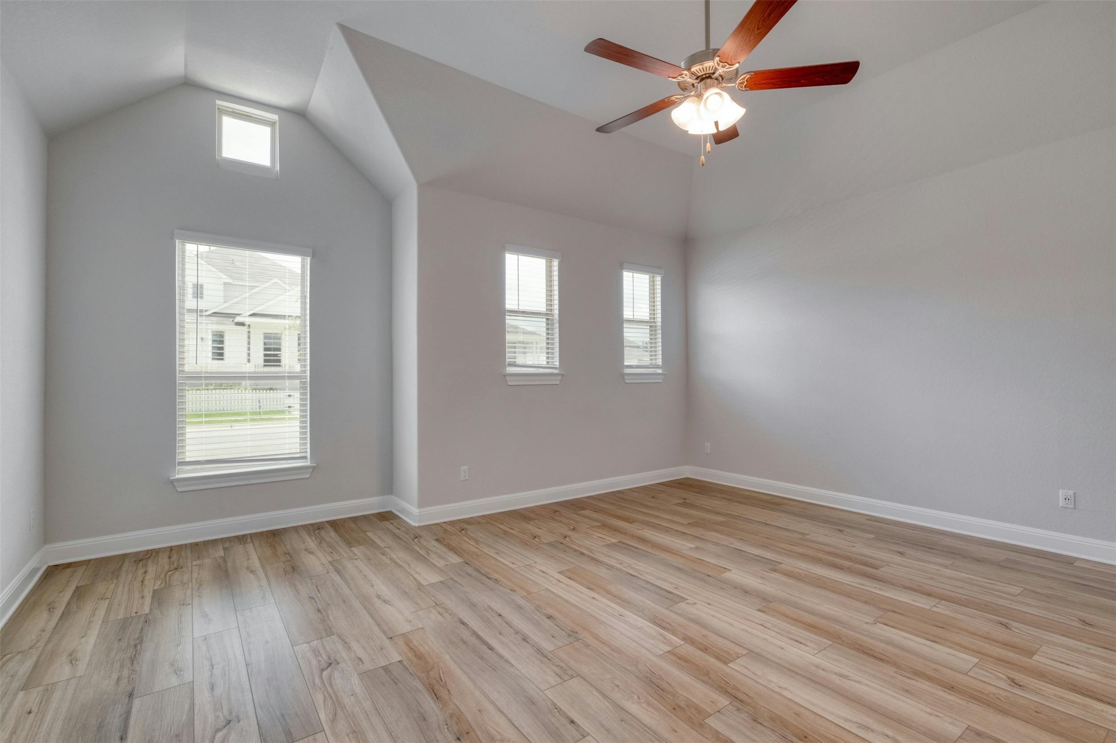 228 Rieber Road Kyle, TX 78640 - Photo 12 of 27 wooden floor in an empty room with a window