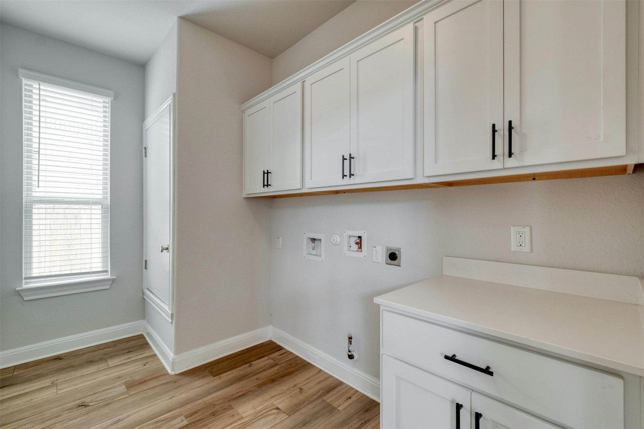 228 Rieber Road Kyle, TX 78640 - Photo 17 of 27 a view of cabinets and wooden floor