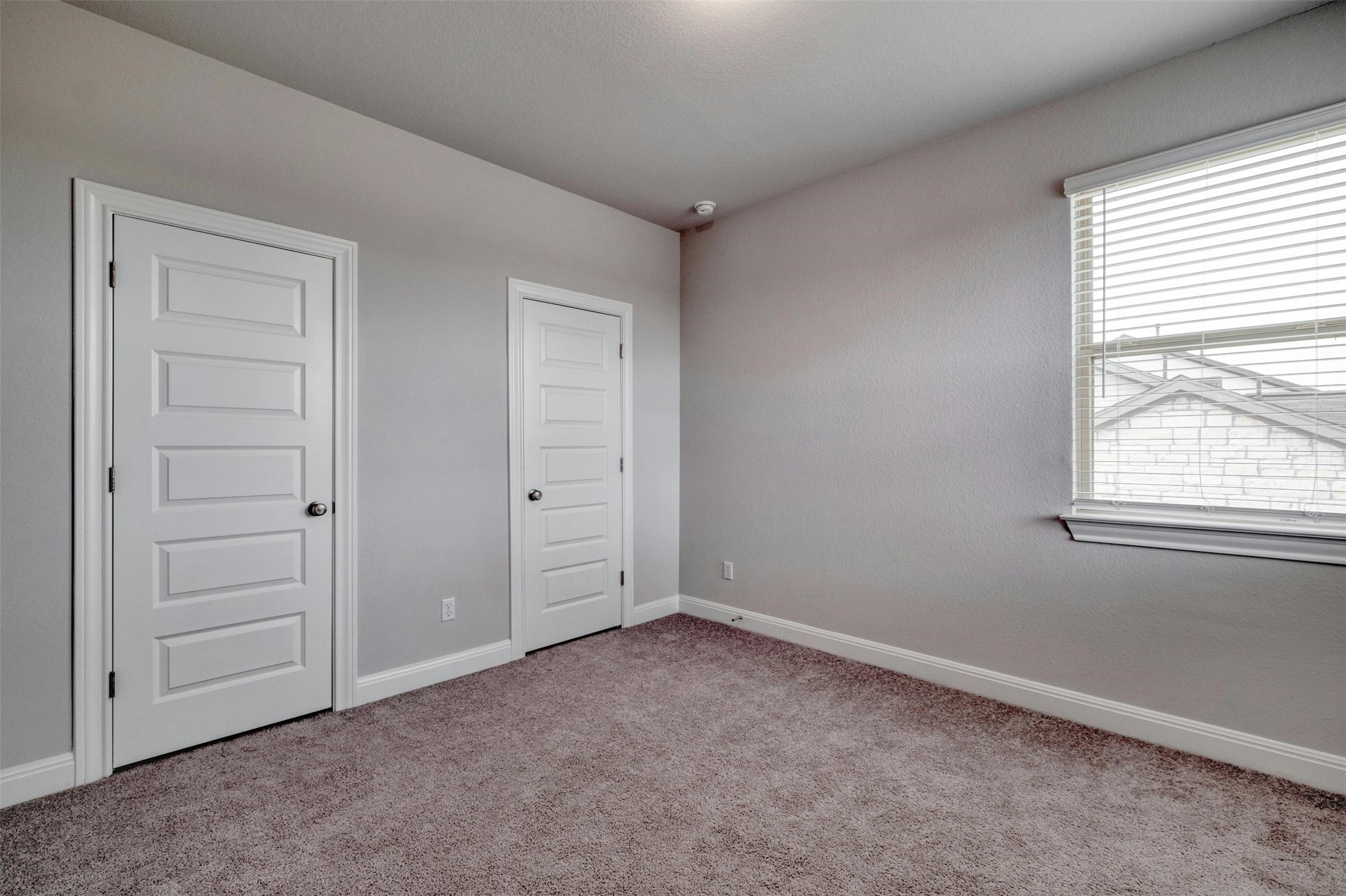 228 Rieber Road Kyle, TX 78640 - Photo 20 of 27 an empty room with windows