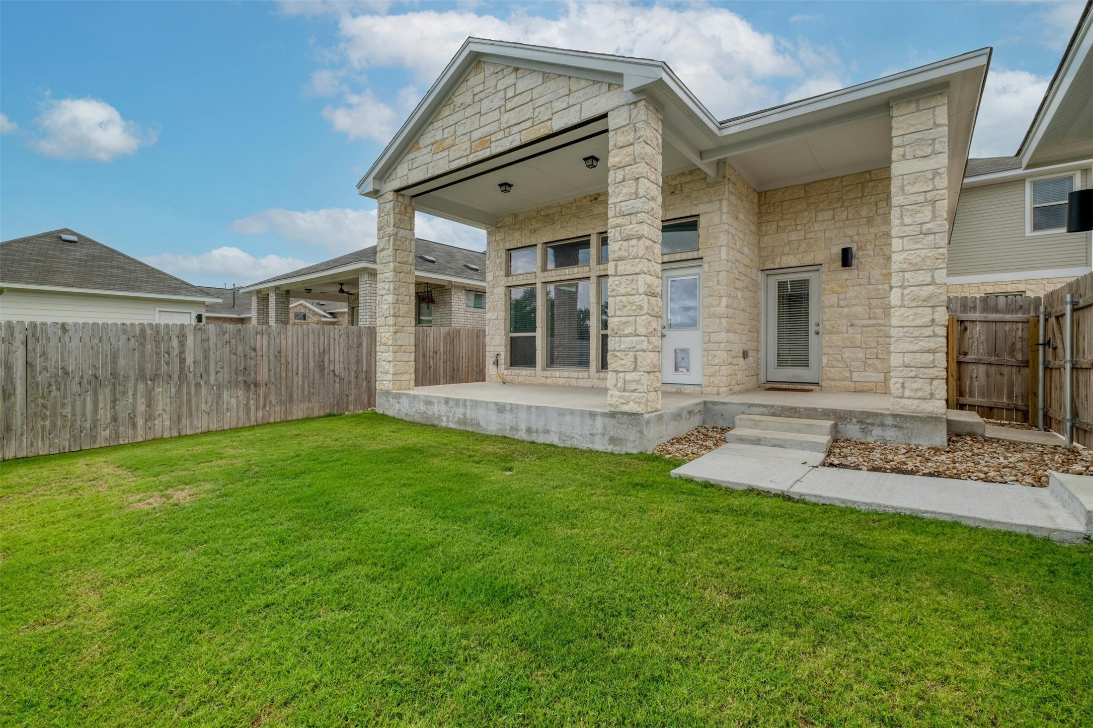 228 Rieber Road Kyle, TX 78640 - Photo 24 of 27 a view of a house with a garden