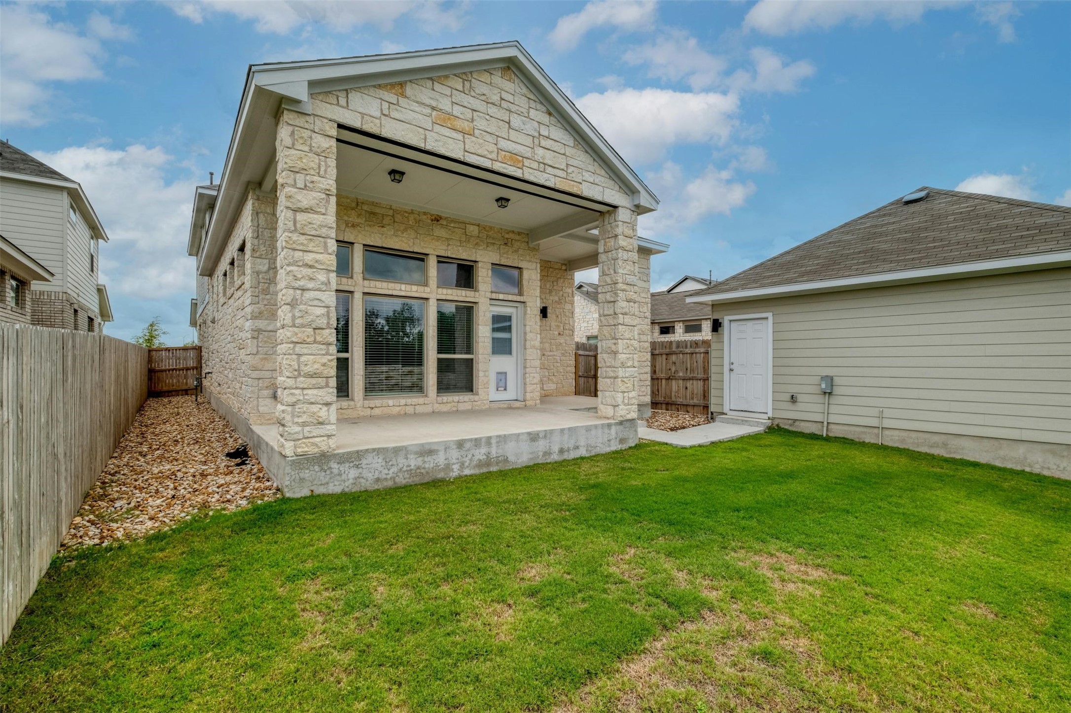 228 Rieber Road Kyle, TX 78640 - Photo 26 of 27 a view of a house with a backyard