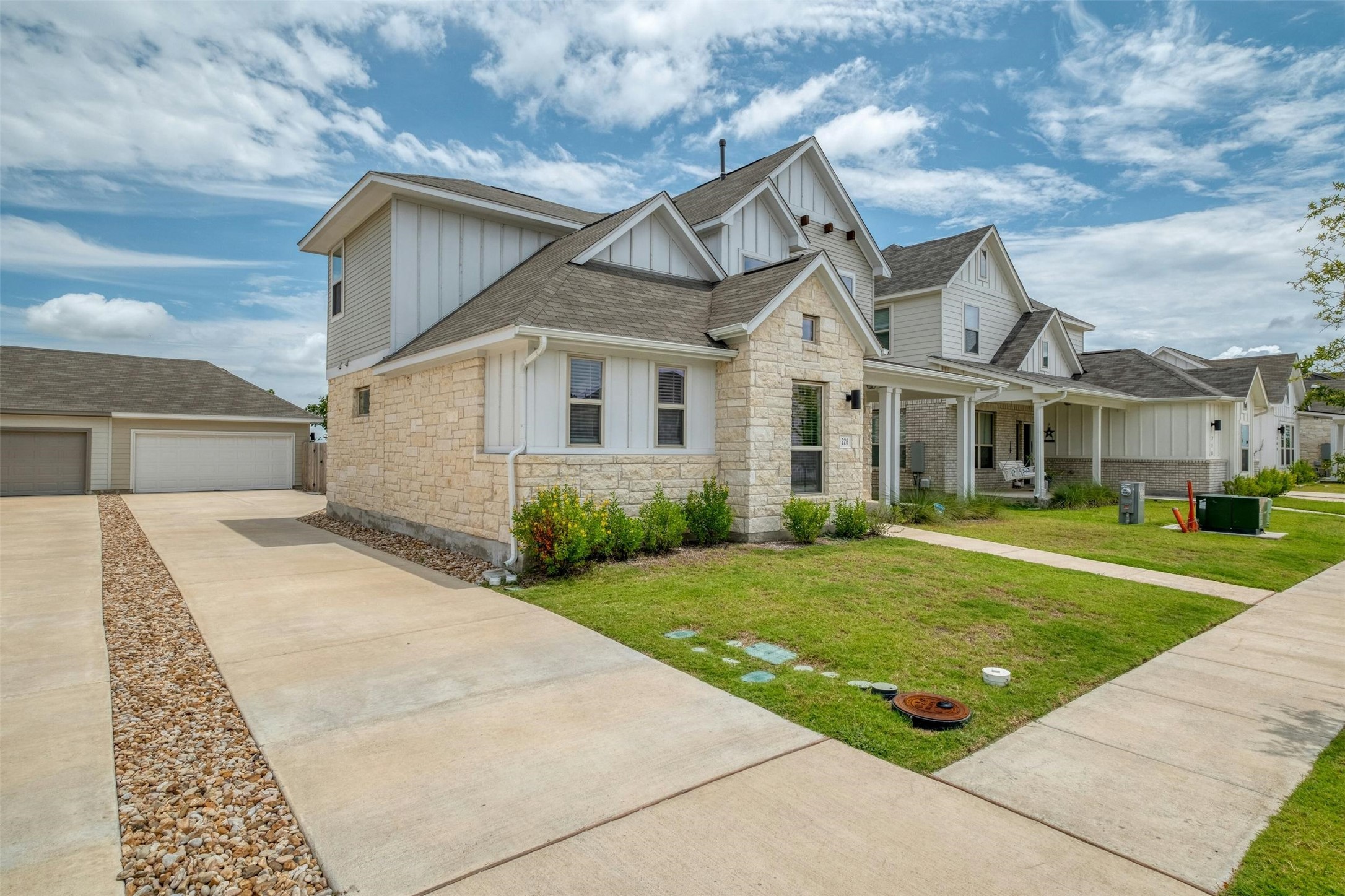 228 Rieber Road Kyle, TX 78640 - Photo 27 of 27 a view of a white house next to a yard with big trees