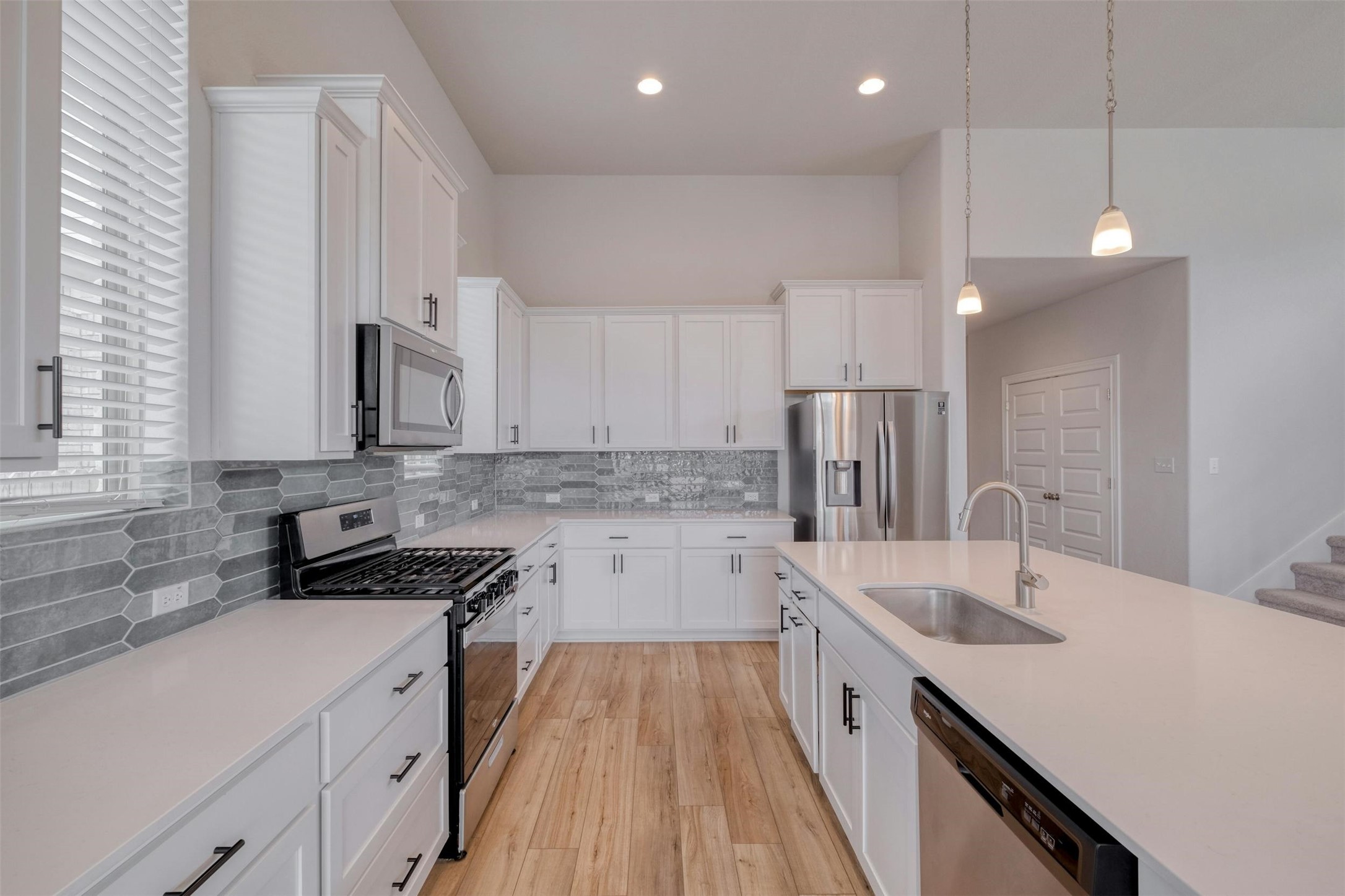 228 Rieber Road Kyle, TX 78640 - Photo 4 of 27 a kitchen with a sink stove and refrigerator
