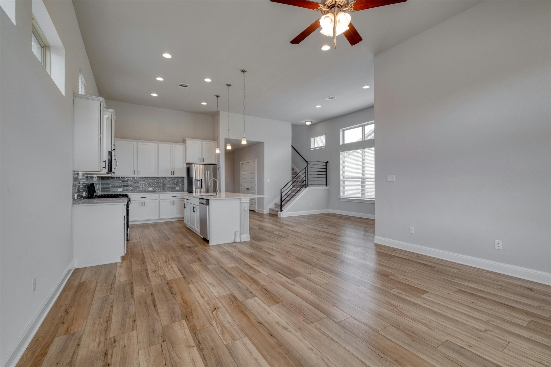 228 Rieber Road Kyle, TX 78640 - Photo 7 of 27 a view of kitchen with cabinets and wooden floor