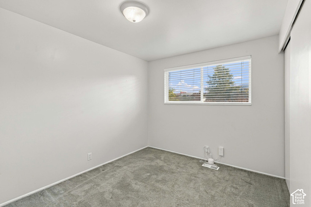 1127 Electra Lane Sandy, UT 84094 - Photo 11 of 27 Recessed window with blinds, overhead flush mount lighting, and gray carpet flooring