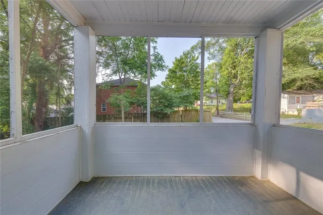 a view of a room with a large window