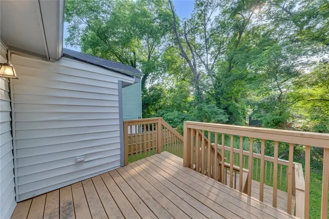 a view of deck with wooden floor and fence