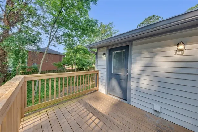 a view of balcony with wooden floor