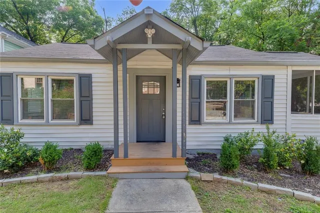 a front view of a house with garden