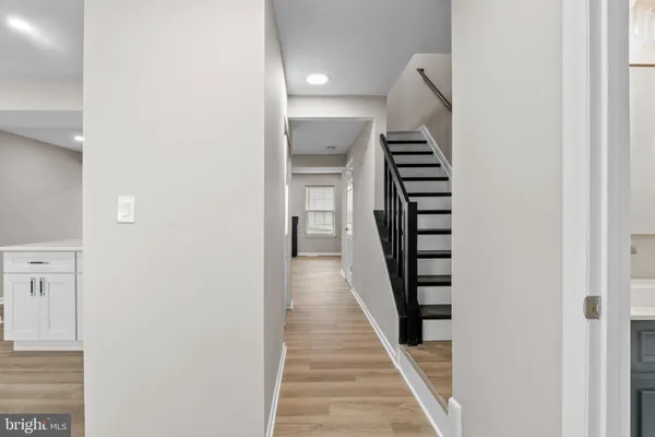 a view of a hallway with stairs