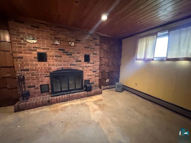 38 Locust Drive Babbitt, MN 55706 - Photo 7 of 29 Unfurnished living room with wood ceiling, a baseboard radiator, concrete floors, and a brick fireplace