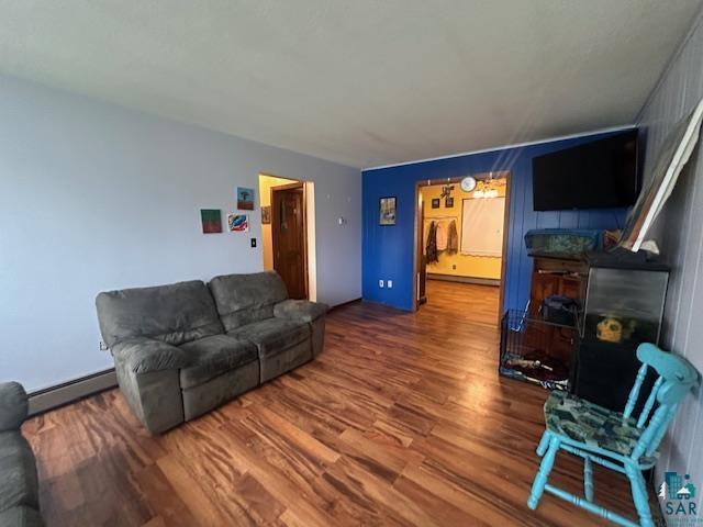 38 Locust Drive Babbitt, MN 55706 - Photo 8 of 29 Living area with baseboard heating and wood finished floors