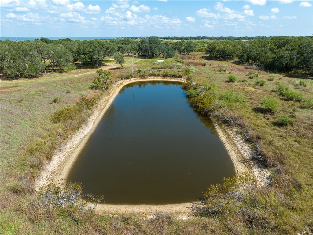 1030 Airport Road Rockport, TX 78382 - Photo 6 of 10 a view of a lake with a yard