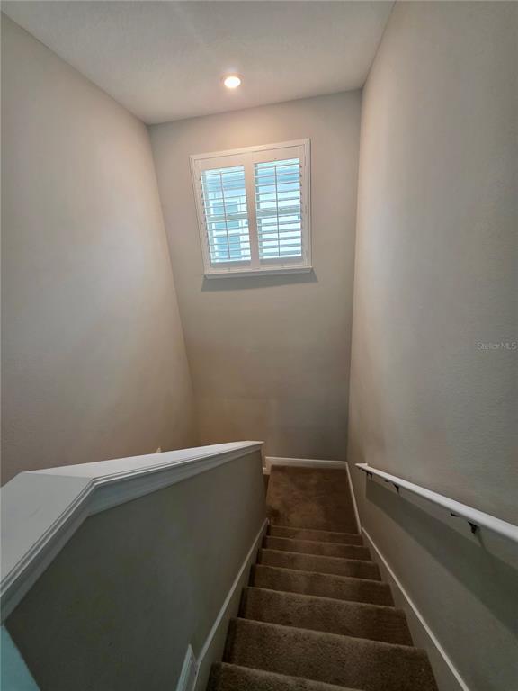 8582 Powder Ridge Trail Windermere, FL 34786 - Photo 13 of 50 a view of a hallway with staircase